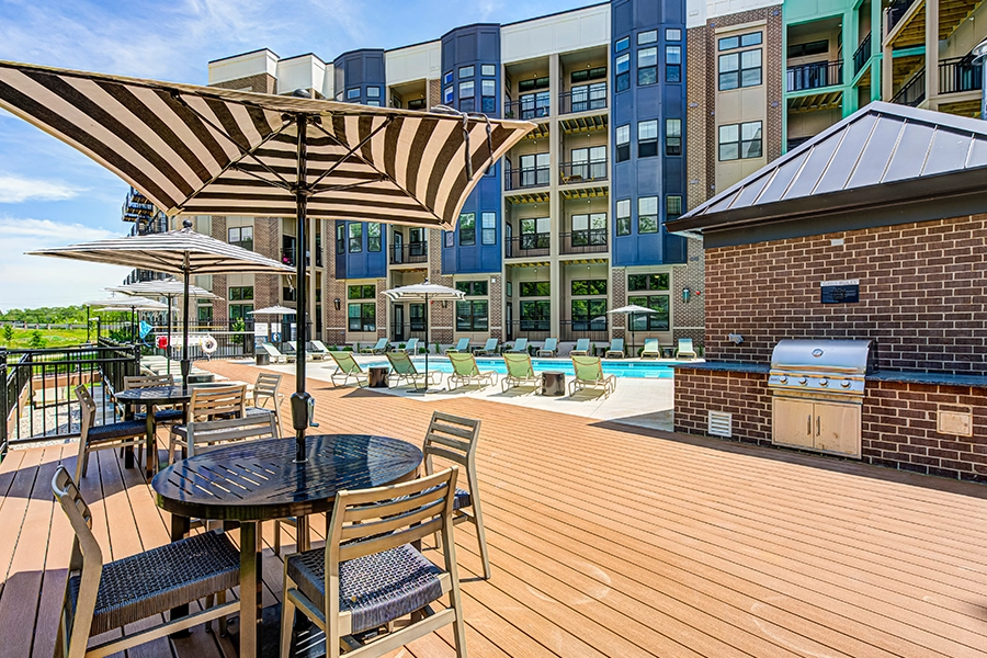Newer apartment communities like East Bank often have valuable move-in deals. View of the pool and exterior of East Bank Apartments