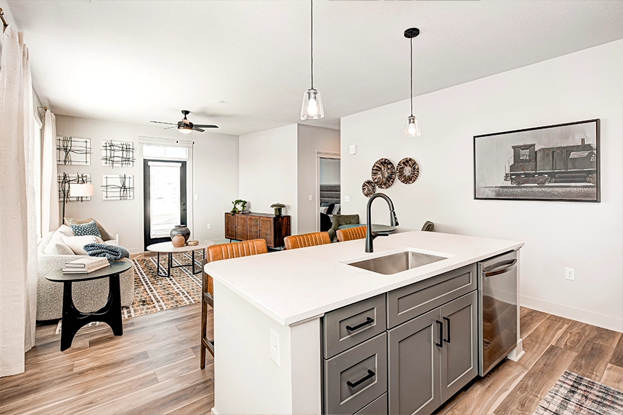 A modern apartment kitchen island and living room