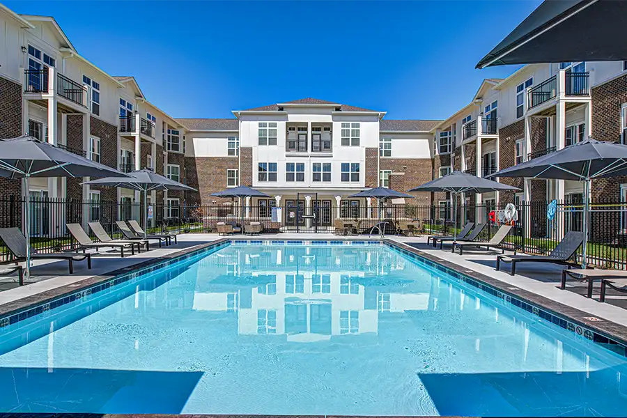 Not sure what a community means by amenities? This pool at Spark Apartments is one example of an amenity. Pristine pool surrounded by apartment buildings at Spark Apartments.